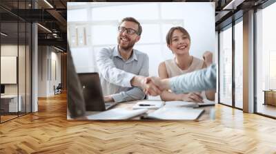 business man shaking hands with his colleague Wall mural