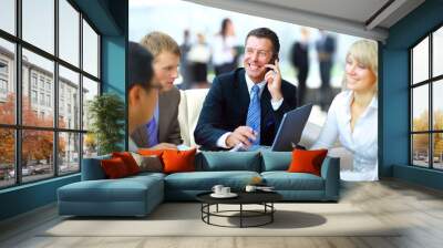 business man speaking on the phone while in a meeting Wall mural