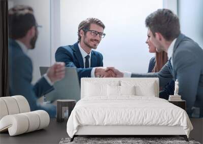 business partners reach out to each other for a handshake Wall mural