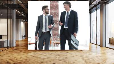 business partners walking down in office building and talking Wall mural