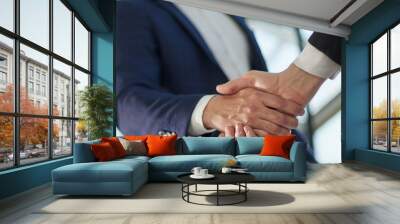 Business partnership meeting concept. Image businessmans handsha Wall mural