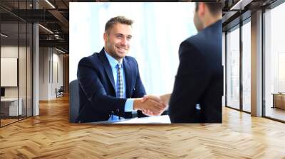 business people shaking hands, finishing up a meeting Wall mural