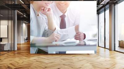 Business team discussing information sitting at the desk Wall mural