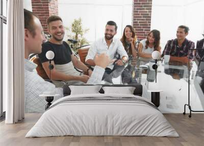 business team sitting at a modern Desk. Wall mural