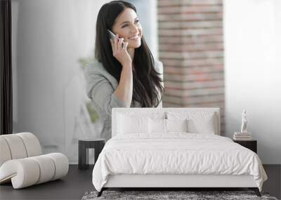 business woman talking on a smartphone. Wall mural