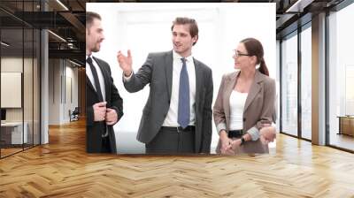 businessman explaining his ideas to his colleagues Wall mural