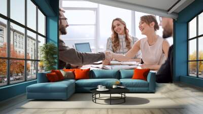 businessman looking at the handshake of business partners Wall mural