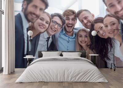 close up.a team of young business people looking at the camera. Wall mural