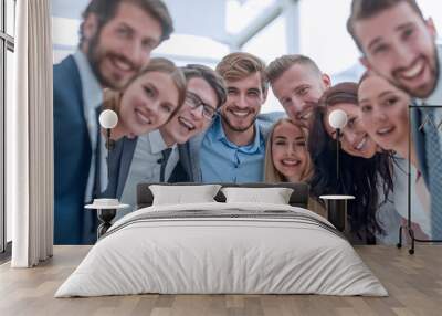 close up.a team of young business people looking at the camera. Wall mural