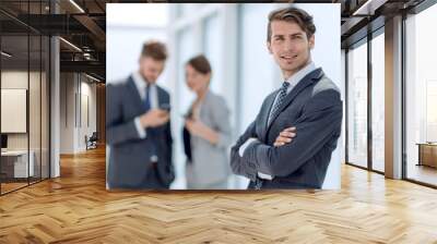 confident young businessman standing in the office Wall mural