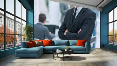 confident young businessman standing in the office Wall mural