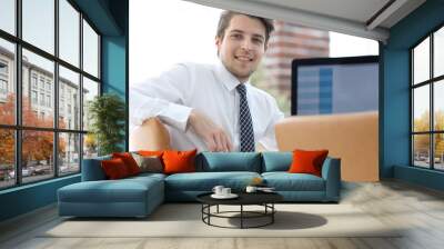 employee sitting in front of a computer screen Wall mural