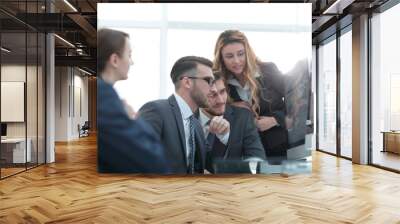 employees discussing financial charts Wall mural