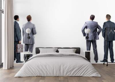 four business mans from the back - looking at something over a white background Wall mural