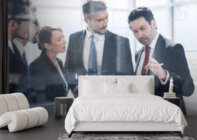 group of business people discussing a financial chart Wall mural