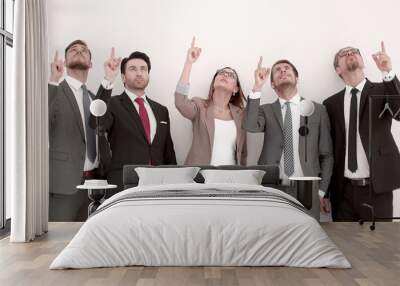 group of business people showing their fingers up. Wall mural