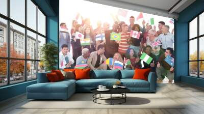 Group of diverse people standing with flags different countries Wall mural