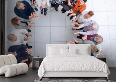 group of smiling older people pointing at you. Wall mural