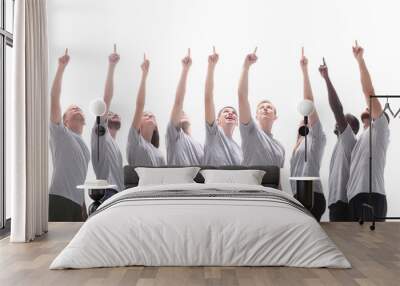 group of young people pointing somewhere up Wall mural