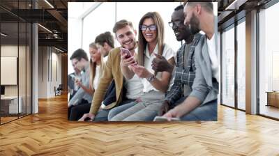 group of young people with smartphones Wall mural