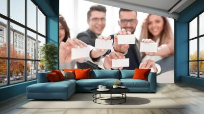 group of young professionals showing their business cards Wall mural