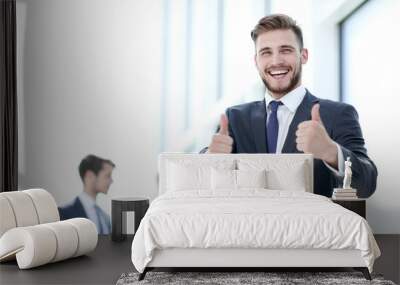 handsome businessman showing thumbs up Wall mural