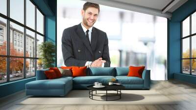 Handsome smiling confident businessman portrait Wall mural