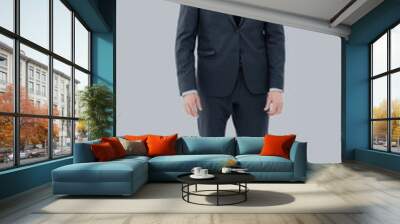 Happy business man wearing grey suit standing and folding arms Wall mural