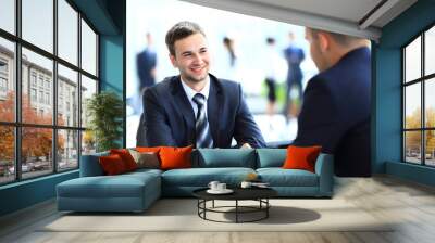 Happy business people talking on meeting at office Wall mural