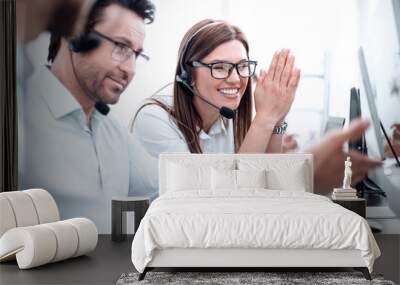 happy call center employees sitting at their Desk Wall mural