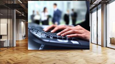 Human hands working on laptop on office background Wall mural