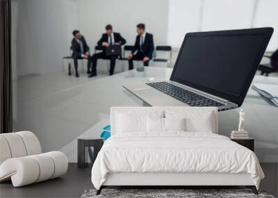 laptop and financial schedule in the office on the table Wall mural