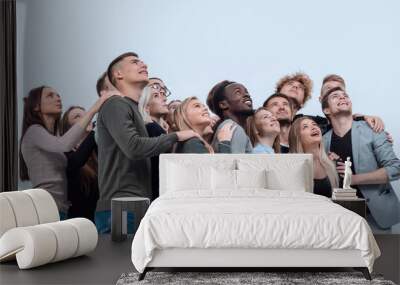 large group of diverse young people looking up hopefully Wall mural