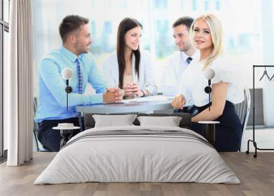 Portrait of a smiling business woman in a meeting Wall mural