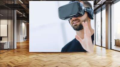 portrait of an amazed guy using a virtual reality headset isolat Wall mural