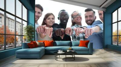 Portrait of excited young business people pointing at you Wall mural