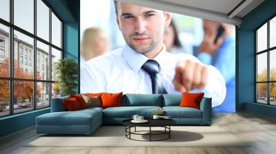 portrait of smiling mature business man pointing at you Wall mural