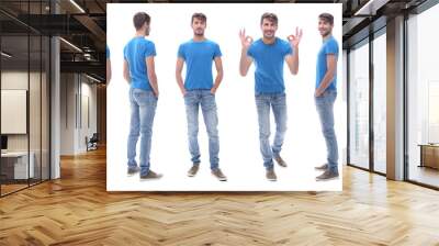 side view . modern young man in jeans. Wall mural