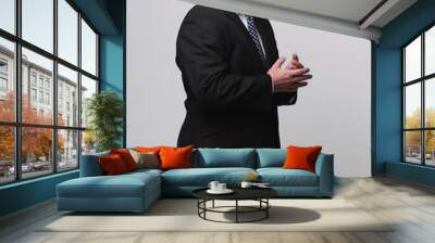 side view. senior businessman is putting his hands in his pockets. Wall mural