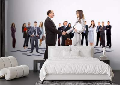 Smiling business people and business shake Wall mural