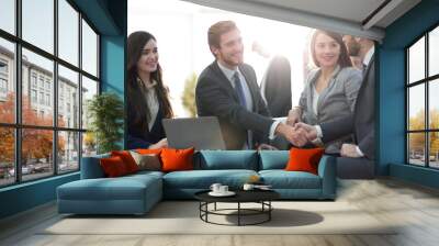 Successful partnership in business displayed by shaking hands in Wall mural