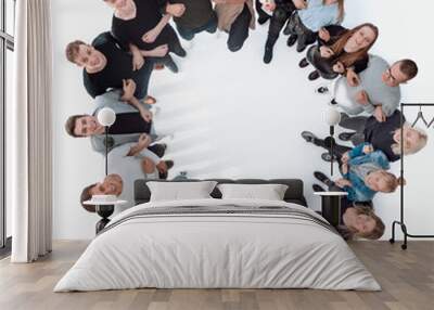 top view . happy group of young people standing in a circle Wall mural