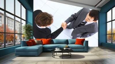 top view of a two businessman shaking hands - Wall mural