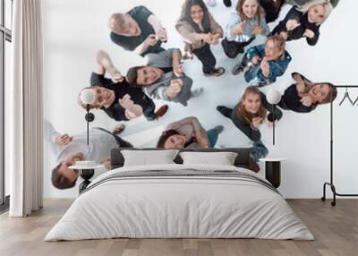 top view. a large group of cheerful young people pointing at you Wall mural