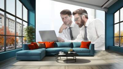 two business colleagues discuss online information Wall mural