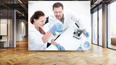 two colleagues sitting at the laboratory table. Wall mural