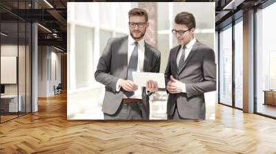 two employees standing in the office Wall mural