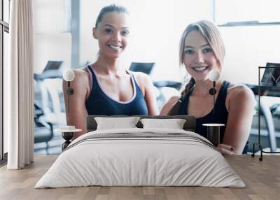 two young woman on the background of the gym Wall mural