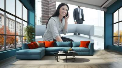 Woman assistant at the workplace in the office Wall mural