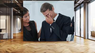 young businessman with tears of joy and his business team Wall mural